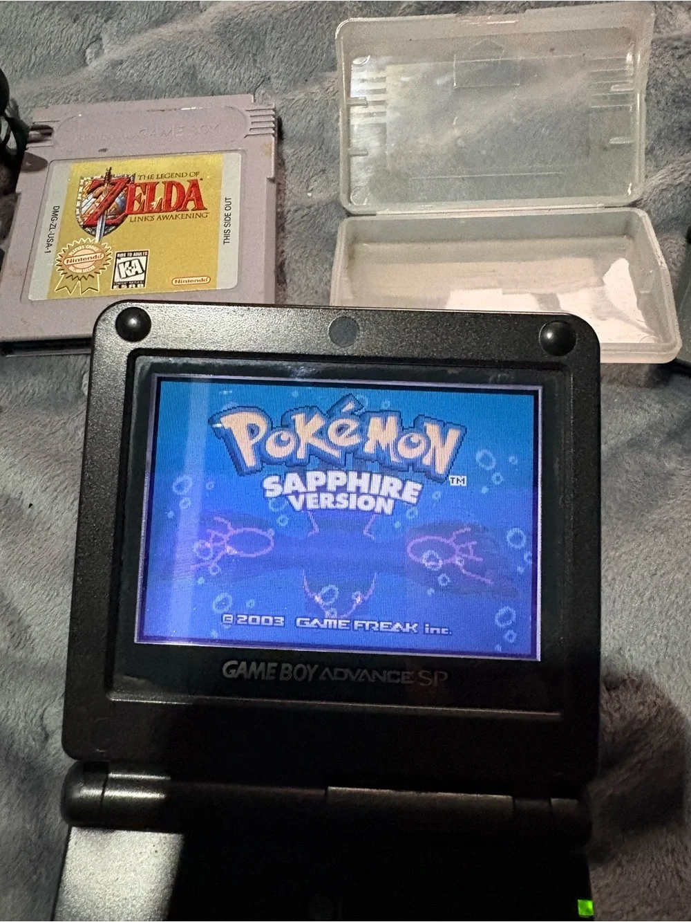 Nintendo Game Boy Advance SP Black with Pokémon sapphire, Zelda, Care Bears